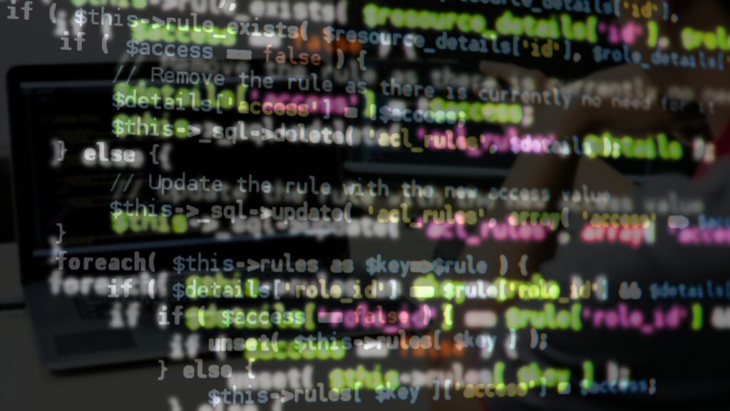 Computer Monitor Screen with Colorful Programming Code Lines Blurred Background Close Up