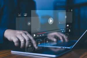 Online video streaming platform and digital content management concept with media player interface, cloud library, and multimedia files on laptop, representing content distribution, video marketing